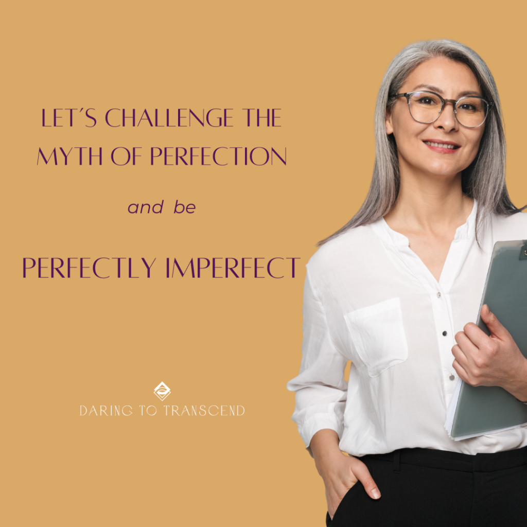 Let's challenge the myth of perfection and be perfectly imperfect. Karen Ann Bulluck Daring to Transcend Woman with long gray hair holding a clipboard in a white blouse and black bottoms.